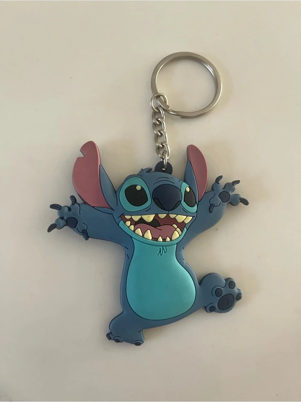 Disney stitch rubber keychain.  Never used, has been sitting in storage.